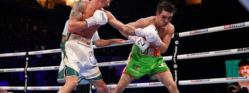 Michael Conlan ‘conscious and stable’ after brutal knockout by Leigh Wood sends him crashing out of ring